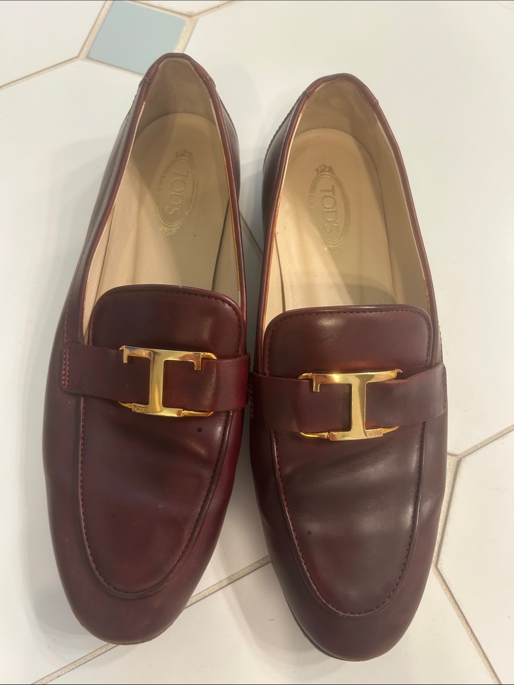 Tod's Men's Burgundy Leather Loafers with Gold 'T' Bit